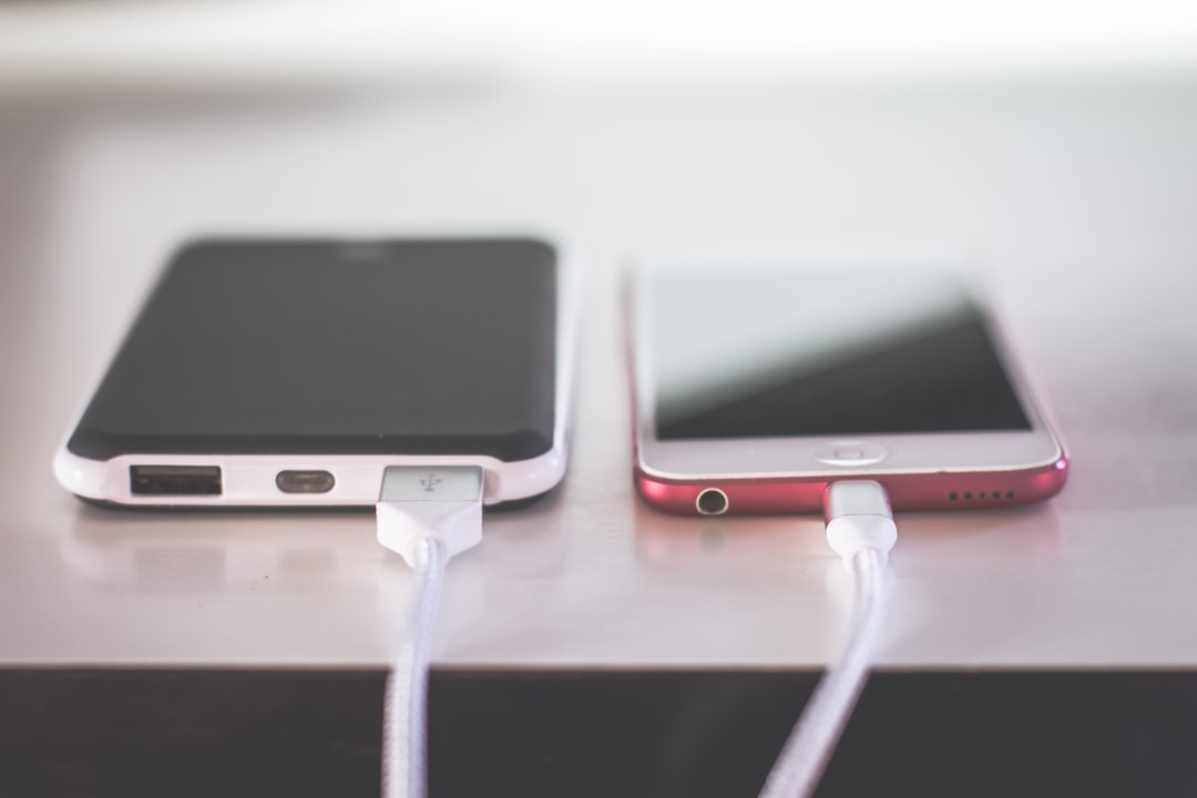 Two smartphones side by side, representing transferring the LMC 8.4 APK file to another phone